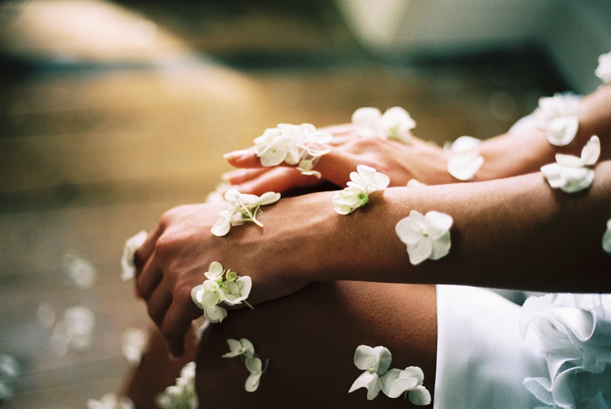 Photo by Chris Jarvis person surrounded by white flowers